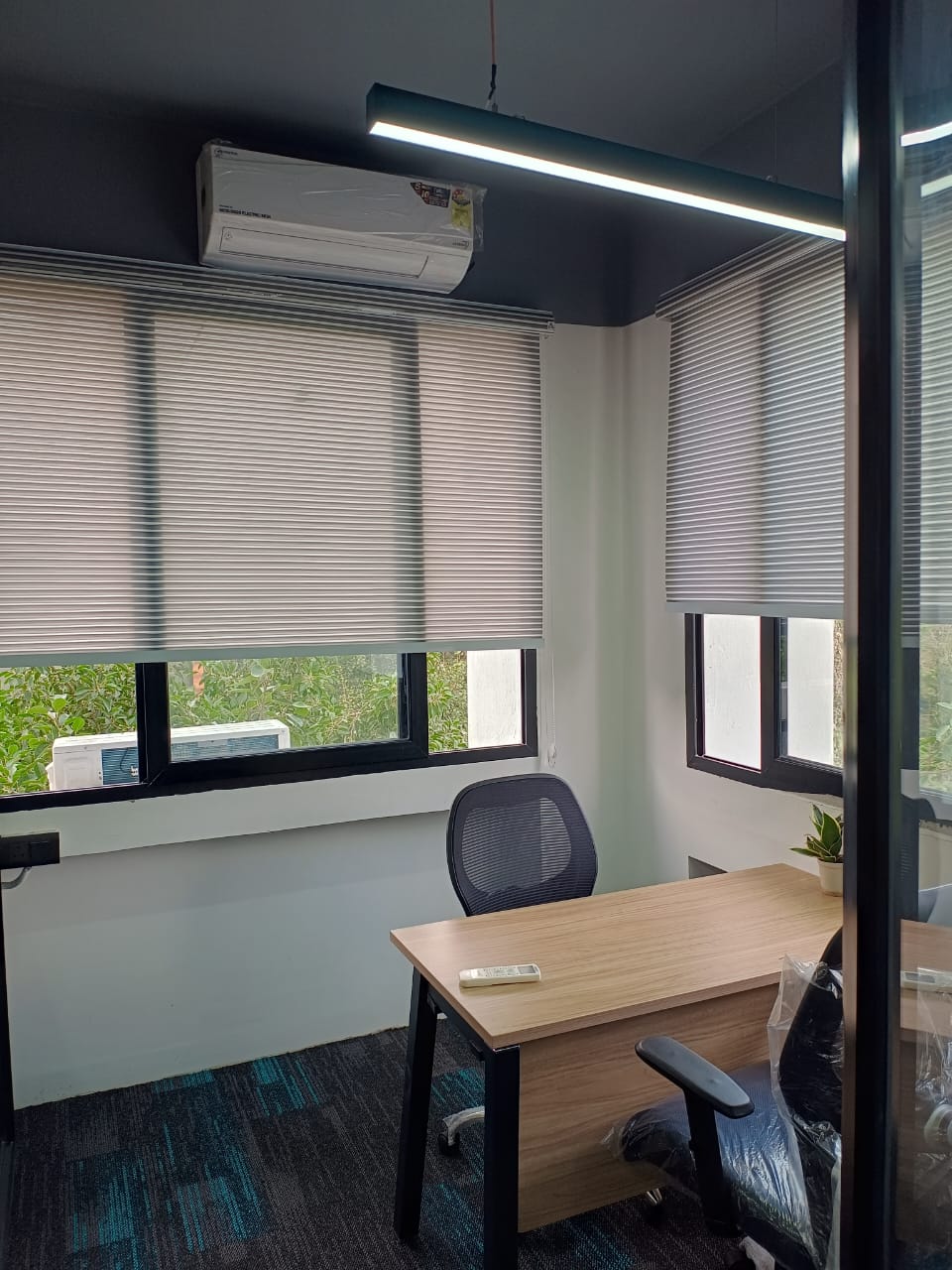 Private cabin with glass walls at AtWork FinTech