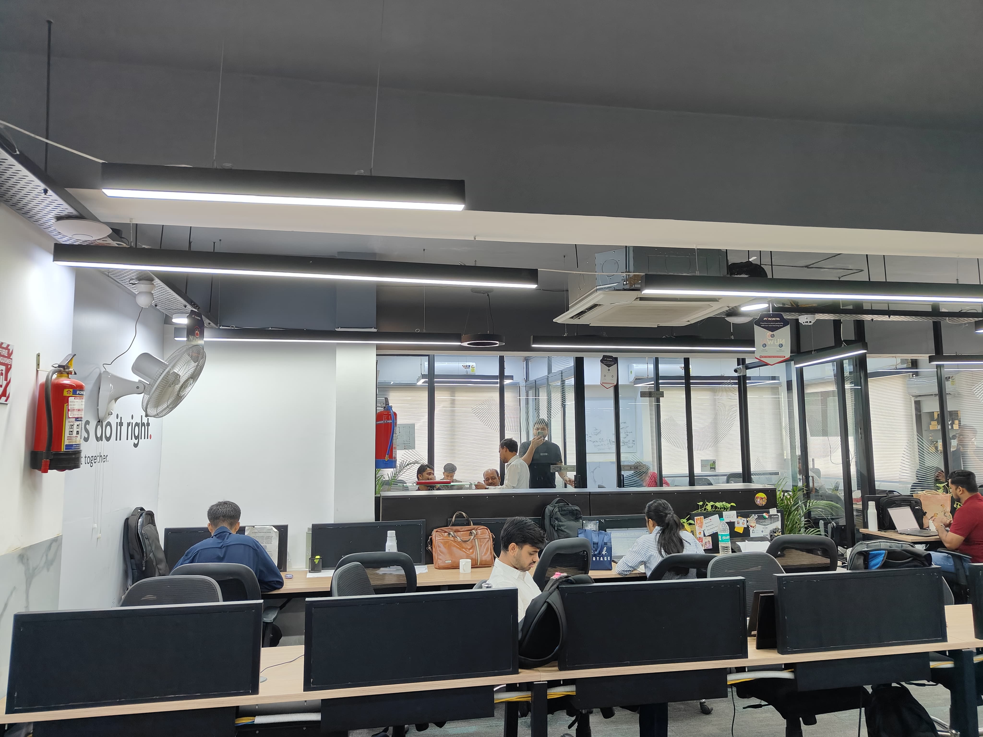 Open coworking floor with desks at AtWork FinTech