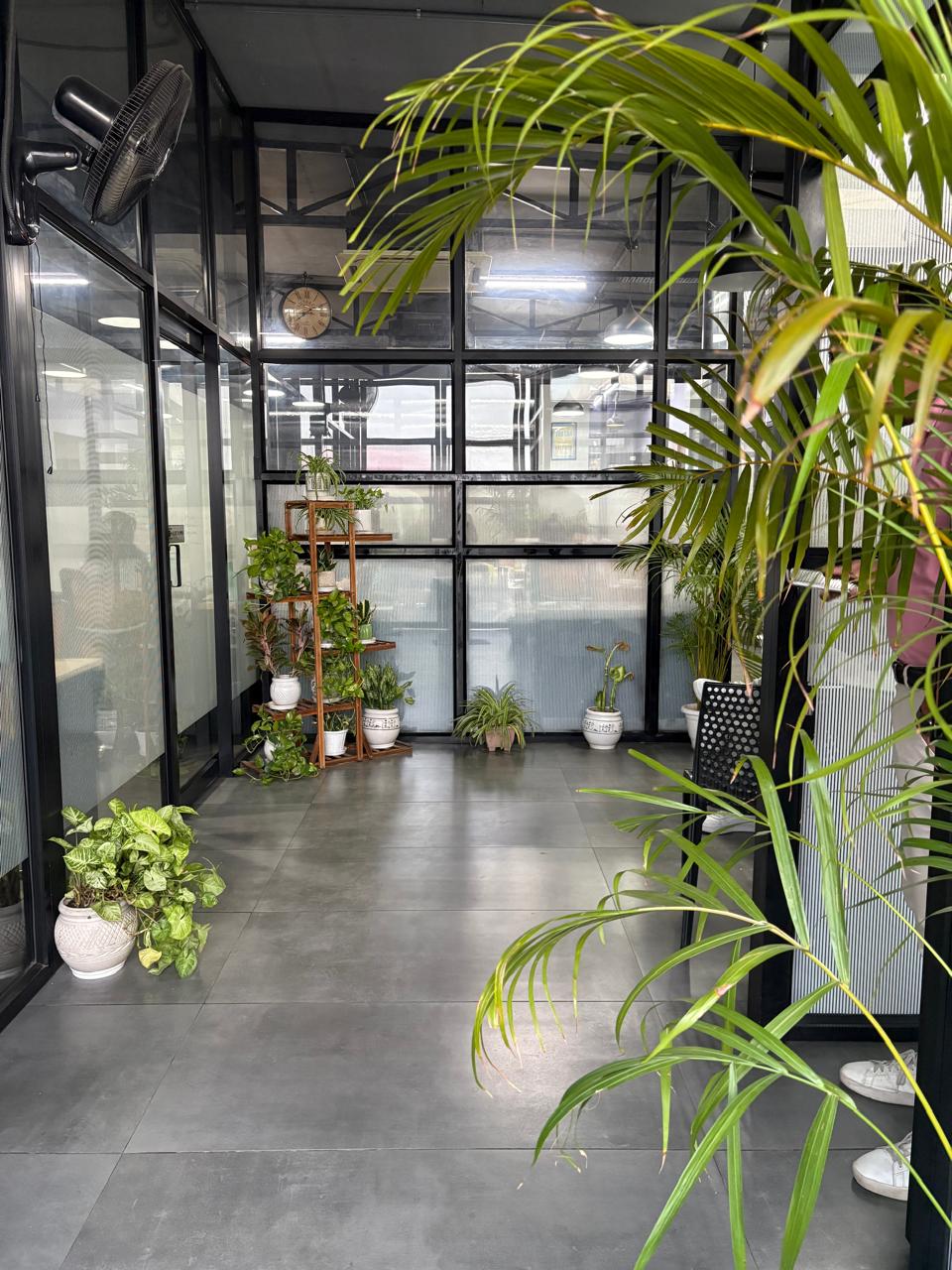 Terrace seating with greenery at AtWork Green House